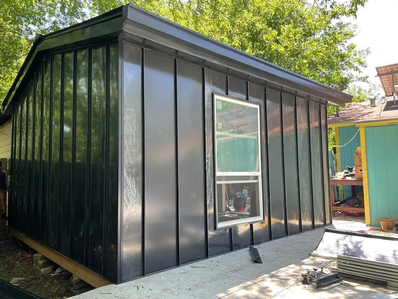 Black standing seam metal wall panels for Roof Inspection in The Villages